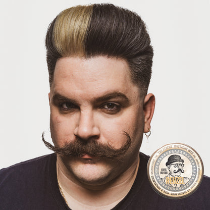 Reuzel Deutschland The Stache Mustache Wax jar with label, designed for shaping and styling mustaches and facial hair.