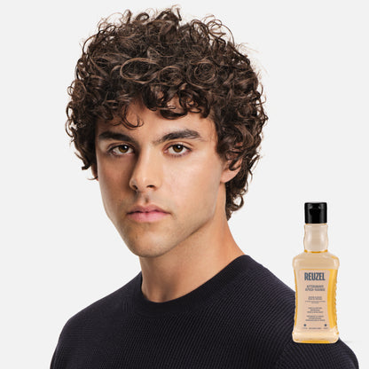 Reuzel Deutschland aftershave with wood and spice scent, featuring a bottle of beard grooming product on a white background.