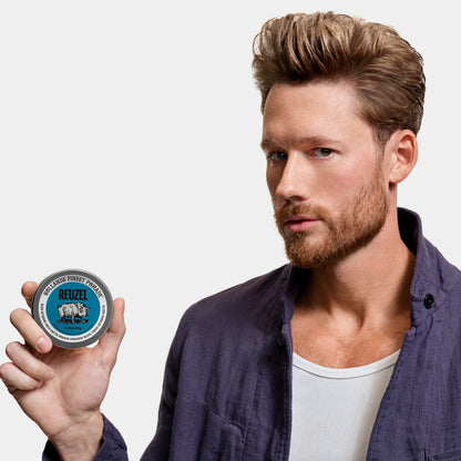 Blue Reuzel Deutschland Extreme Hold Matte Pomade jar with label, designed for strong, matte hairstyle hold.